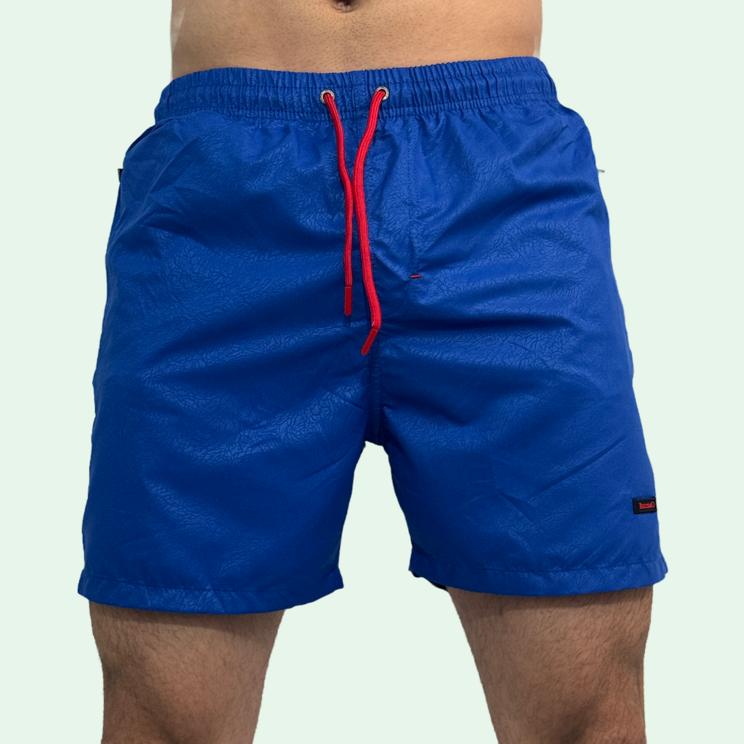 TEXTURED SWIMMING TRUNKS